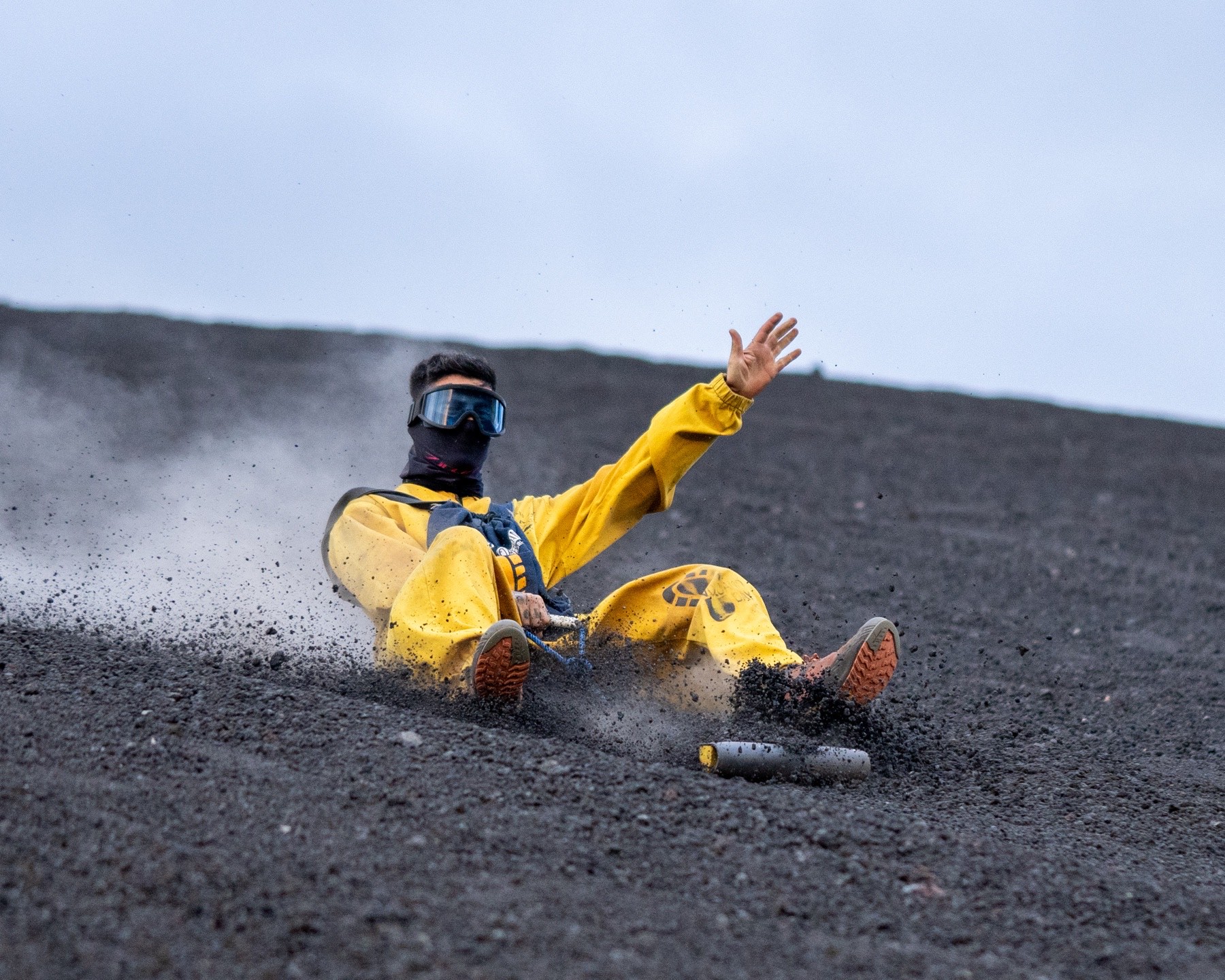 Volcano boarding down Cerro Negro at sunrise
