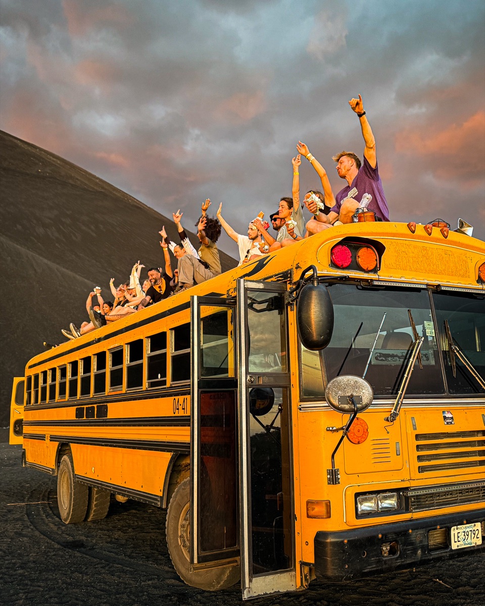 Travelers on a Volcano Day tour at sunset